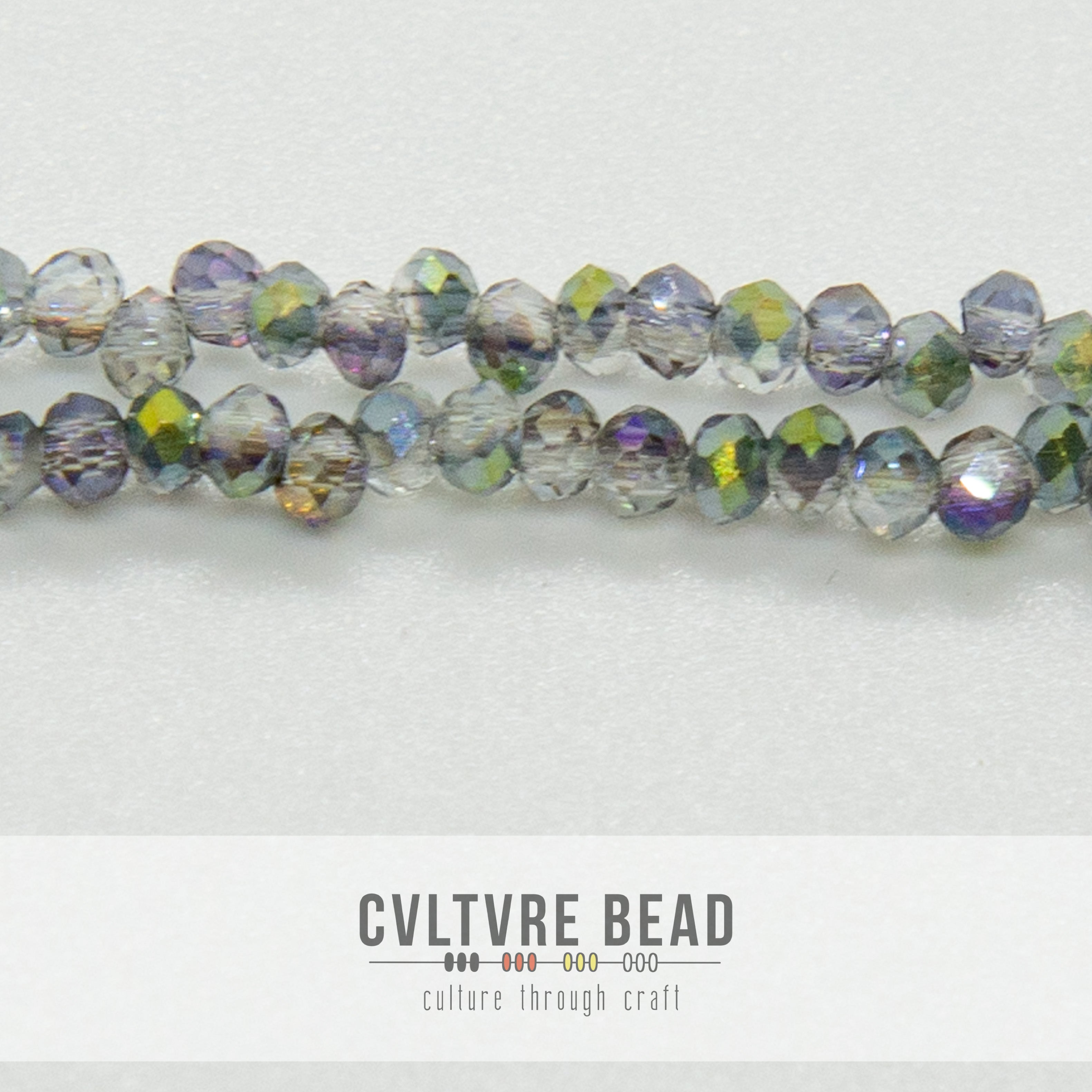 Crystal Lane Rondelle - 1.5x2.5mm -  Trans. Rose Green Luster